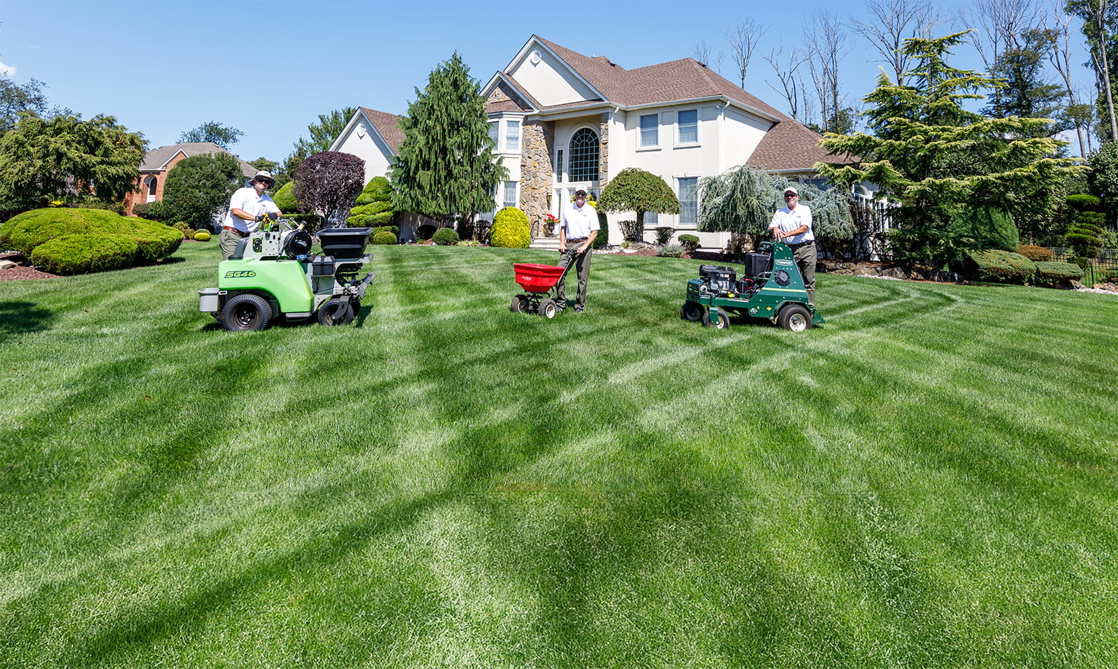 Professional lawn care team from Minnesota Yard Pros with commercial equipment serving Twin Cities area homeowners